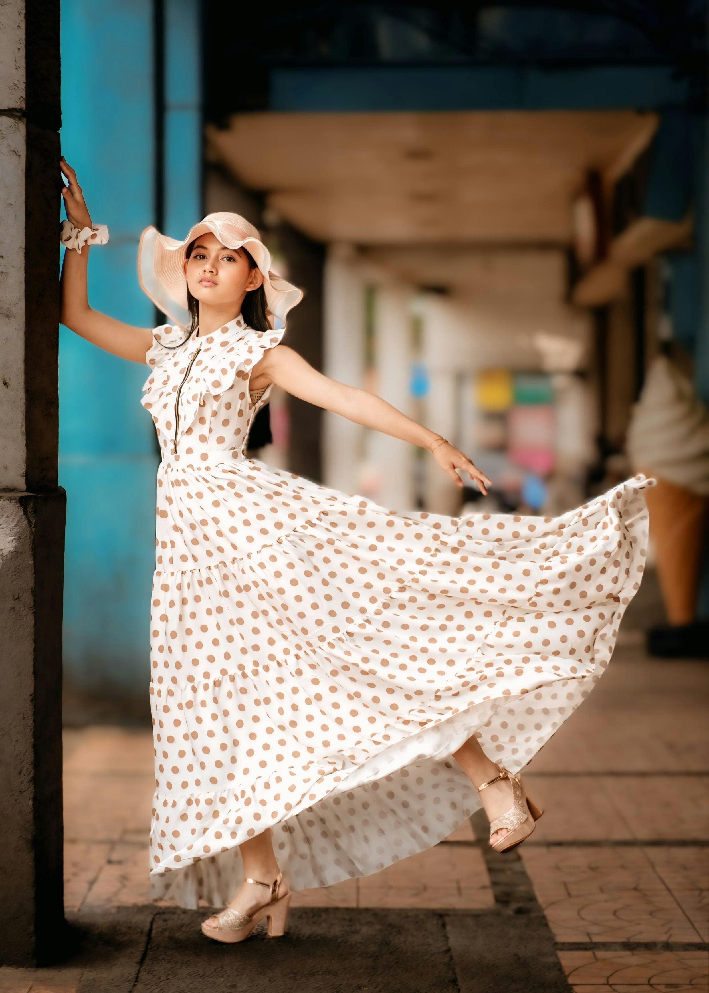 Model in a flowing gown against soft natural light